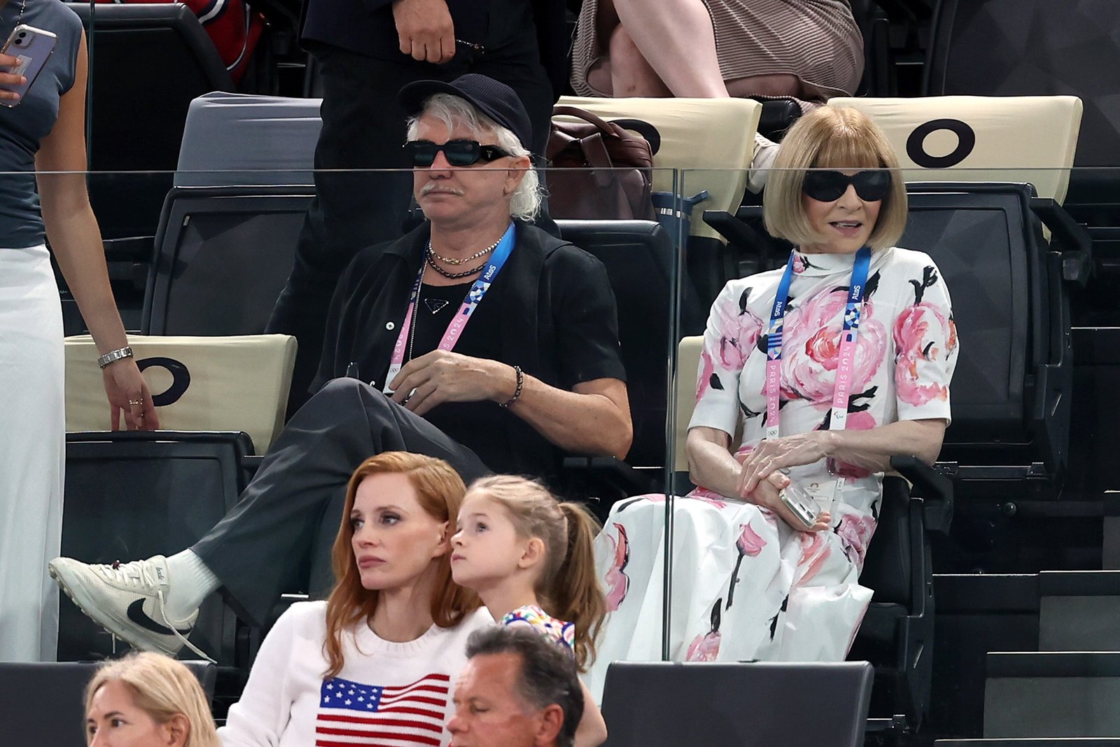 Vogue editor Anna Wintour and film director Baz Luhrmann, and actress and producer Jessica Chastain in front.