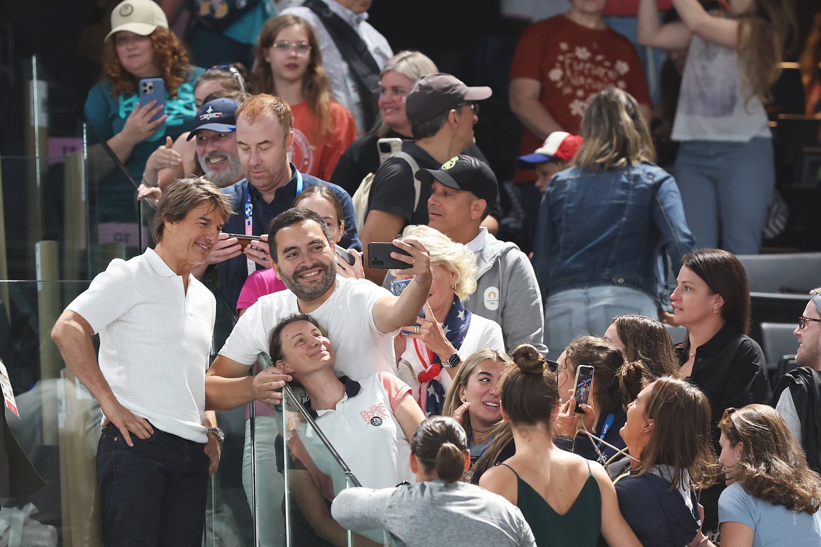 Tom Cruise takes a selfie with fans